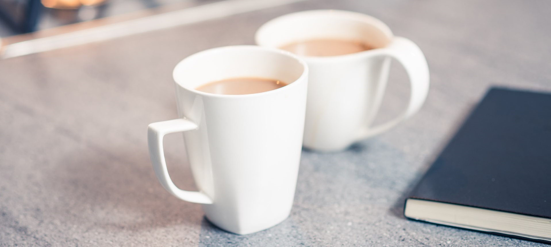 white mugs on kitchen worktop