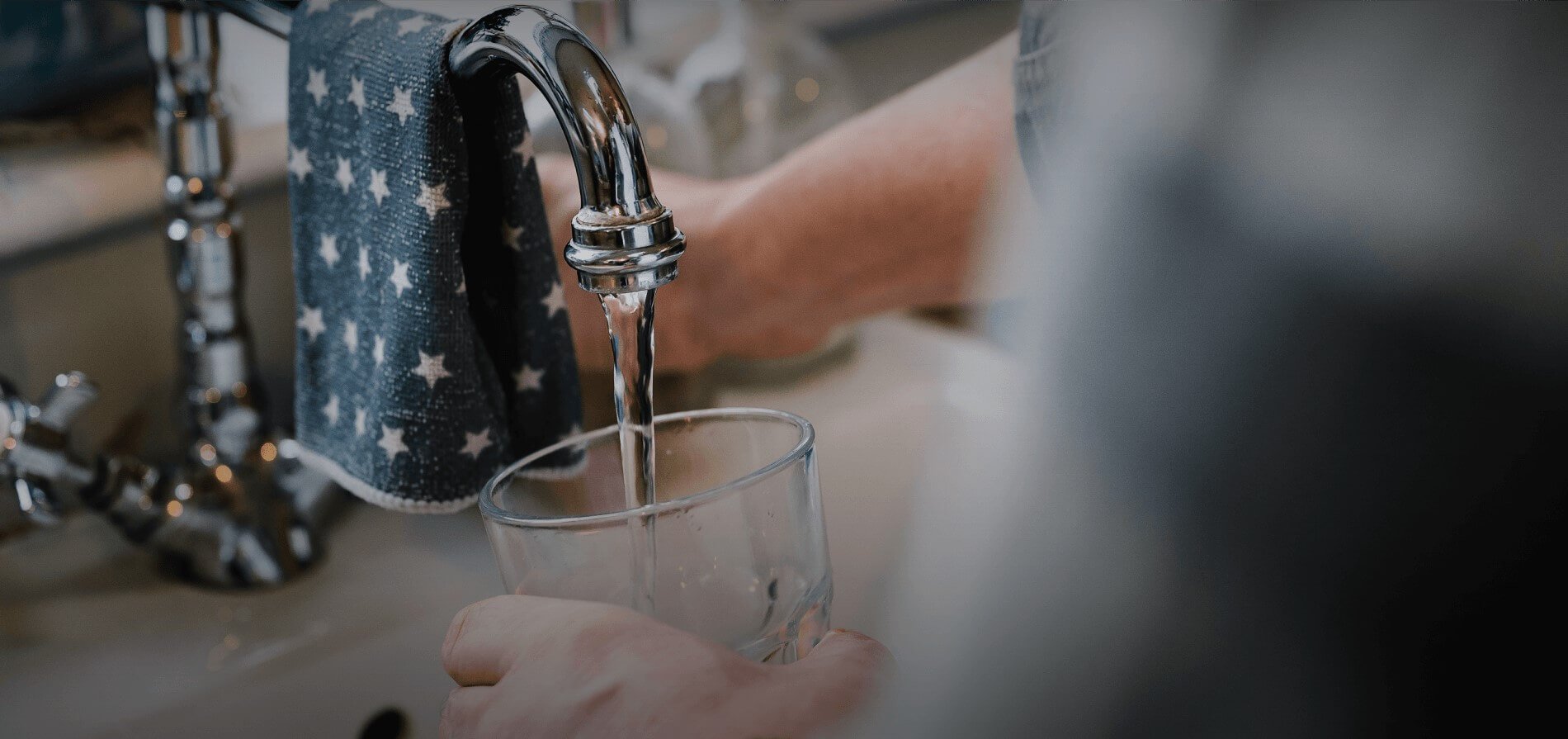 Glass being filled with tap water