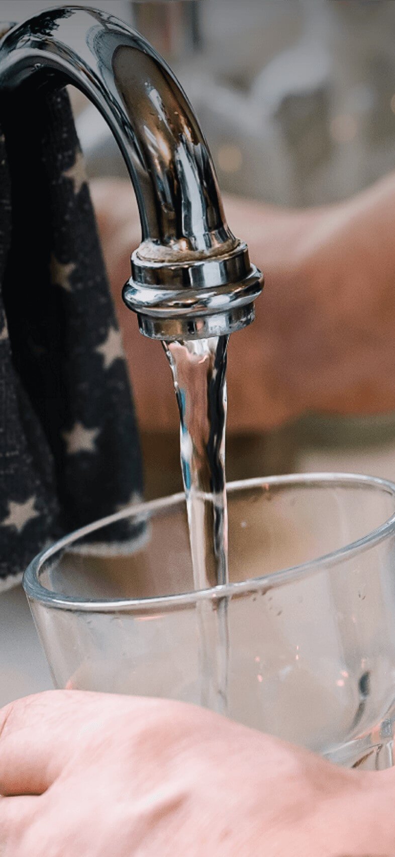 Glass being filled with tap water