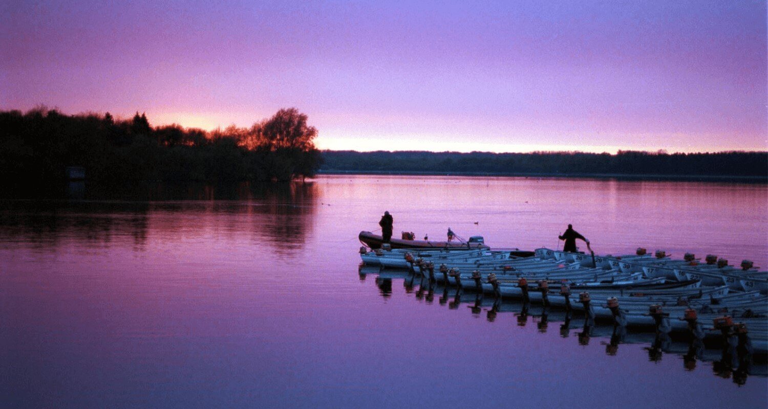 Two fishermen with boats at Hanningfield Reservoir