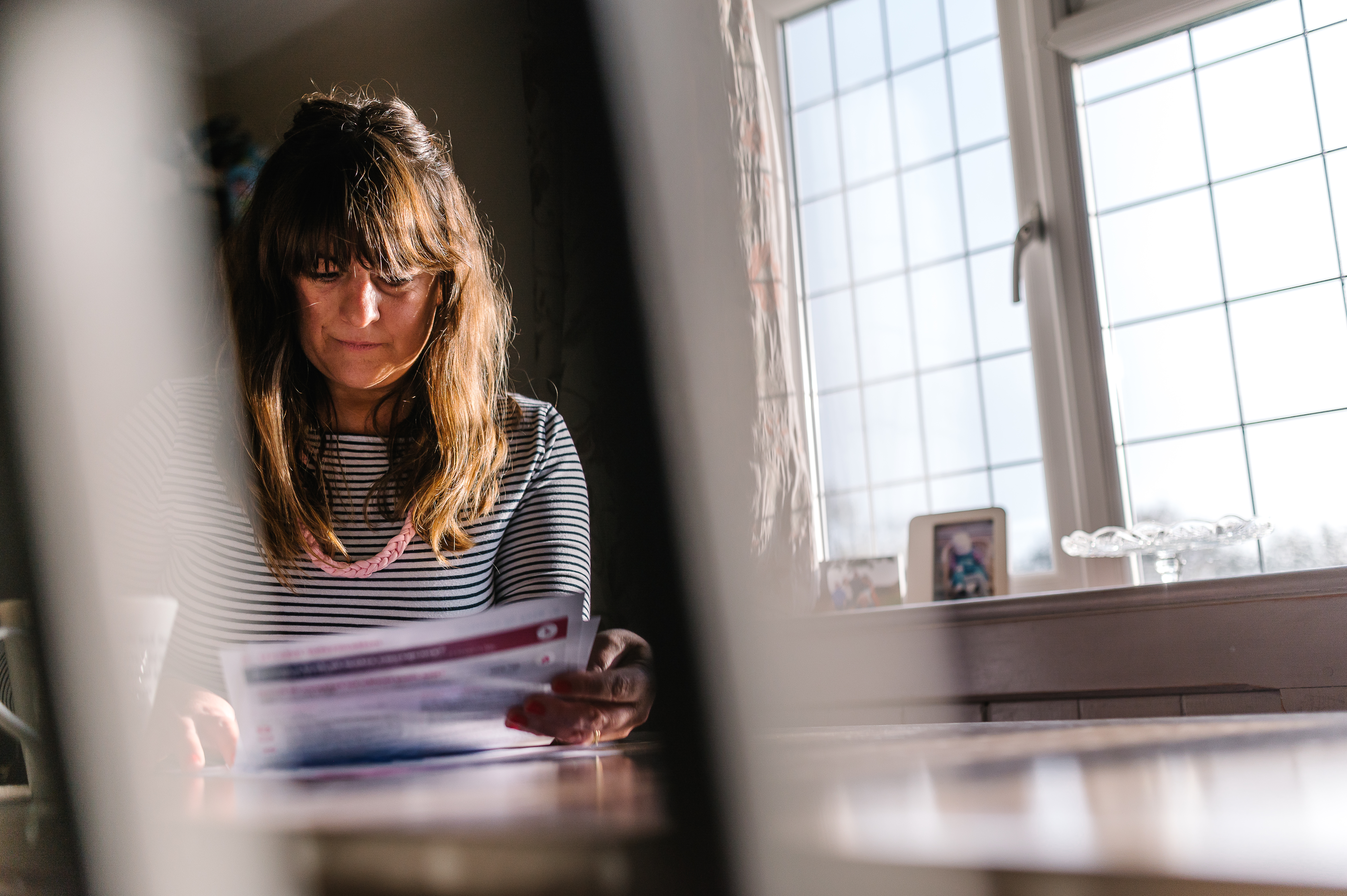 woman reading bill